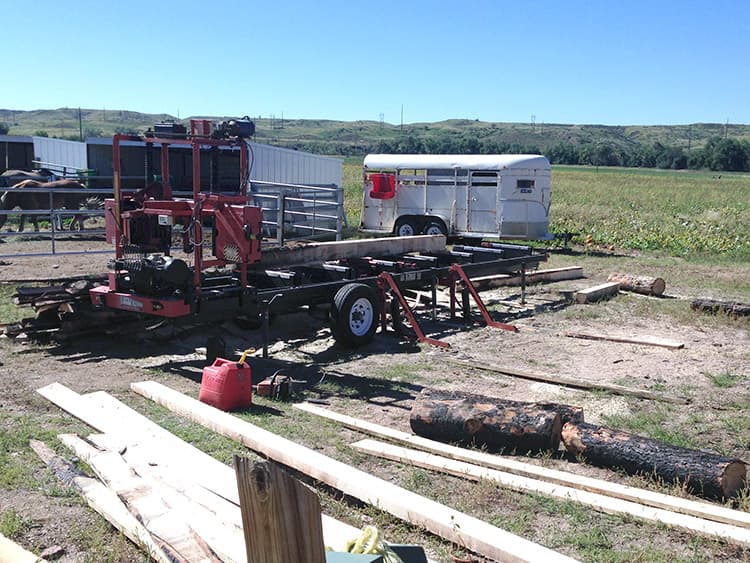 The portable sawmill on site at Venetucci Farm, milling logs into lumber