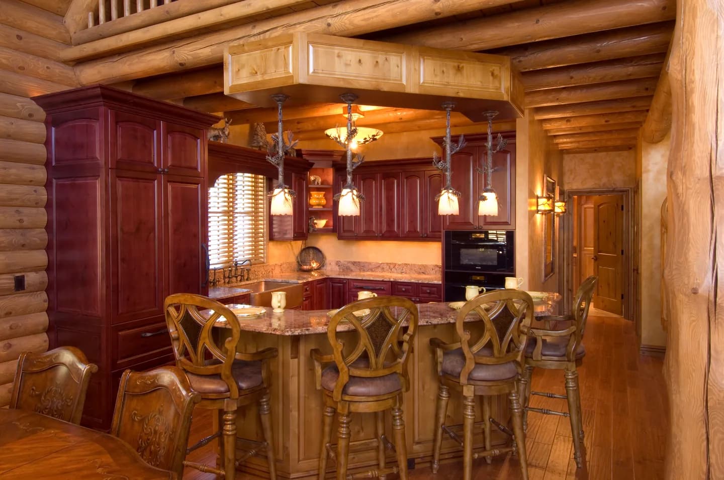 Kitchen of a full-log Stauffer & Sons home at Culebra Mountain Ranch