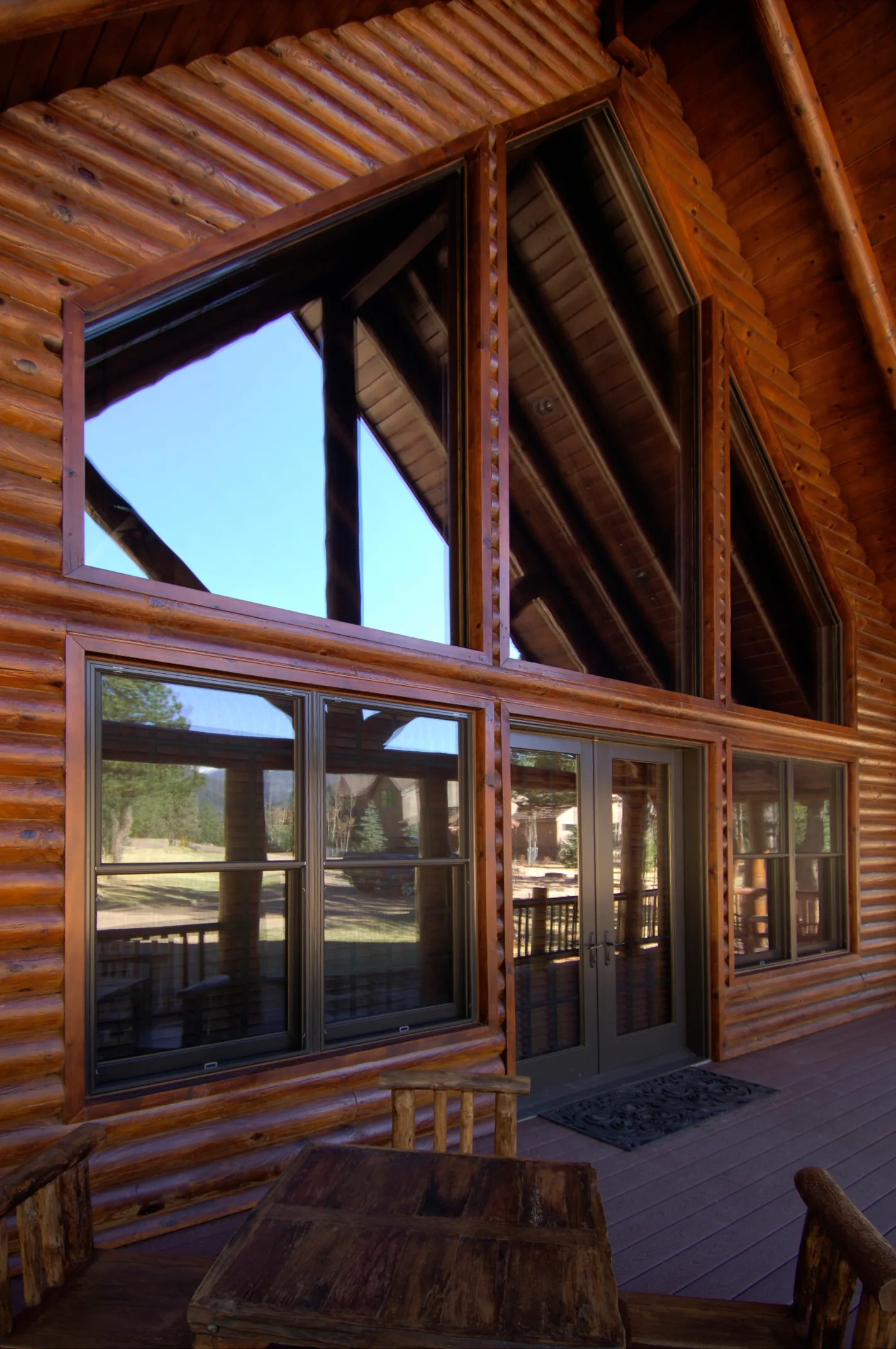Covered outdoor living space at a full-log Stauffer & Sons home in southern Colorado